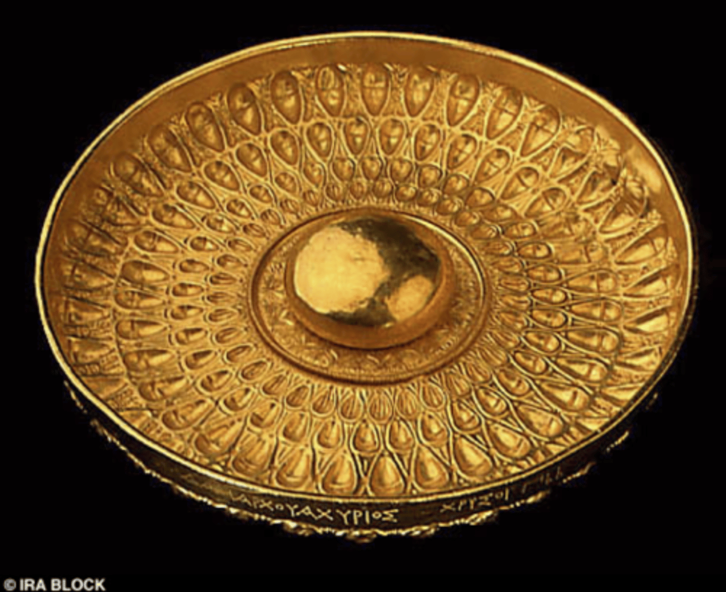 <p>A shallow bowl-cup for pouring libations, designed to fit the hand with fingers in the hollow and thumb on the lip.</p>
