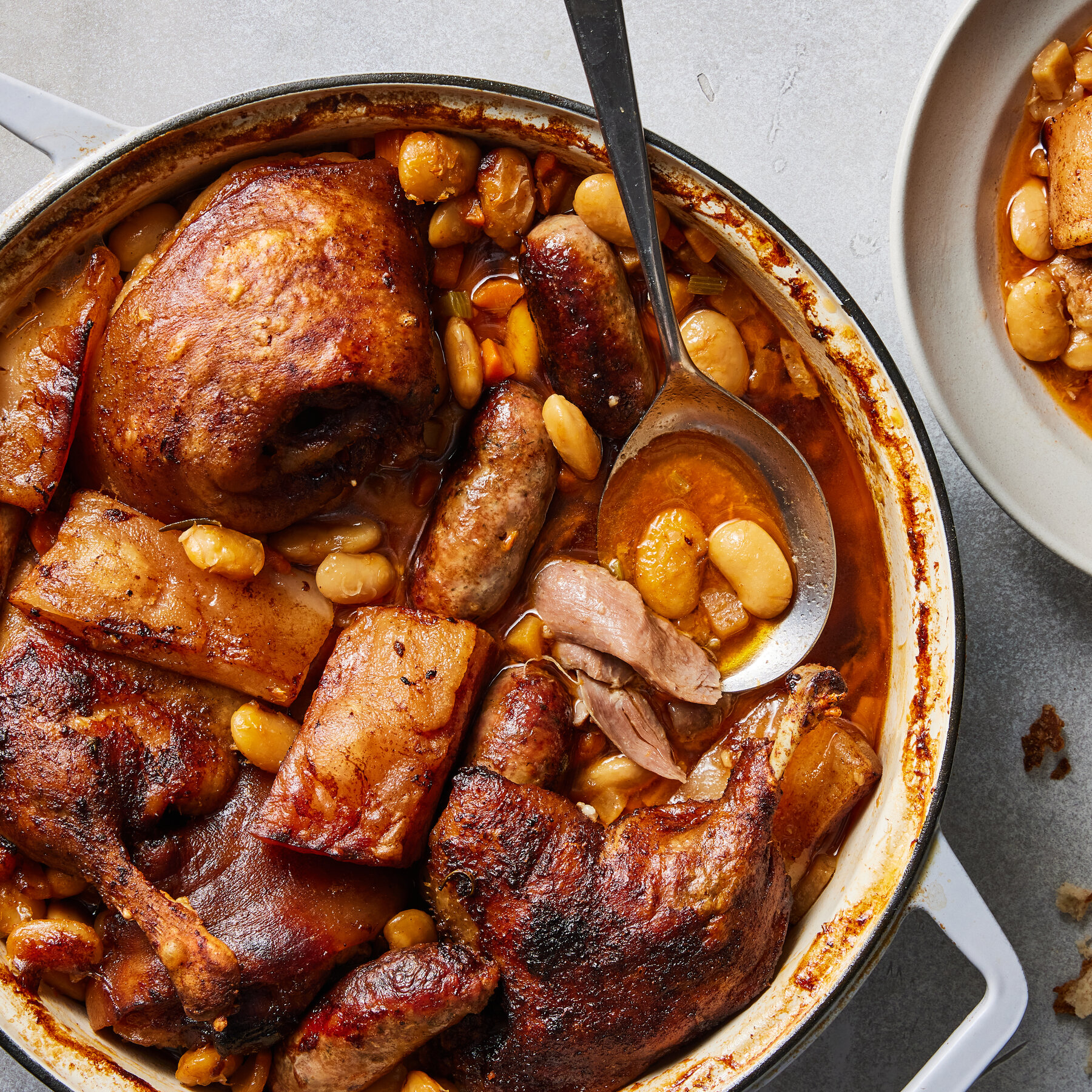 <p><span style="color: rgb(0, 29, 53)">A hearty French casserole dish, originating in the Languedoc region of southern France. It's known for its rich, slow-cooked flavors and typically features white beans, various meats (like duck confit, pork, sausages), and herbs.</span></p>