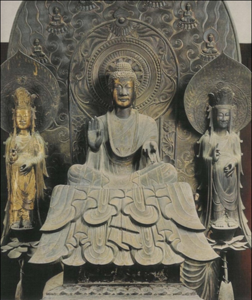 <p>Artist: Tori Busshi</p><p>Date: 623 CE</p><p>Location: Inside Kondo (main hall), Horyu-ji.</p><p>Nara prefecture, Japan.</p><p>Stylistic Period: Asuka period, Japan.</p><p>Medium: Gilt bronze</p><p>Commissioner: Empress Suiko and other</p><p>court members</p><p>Height: 46" (116.8 cm).</p>