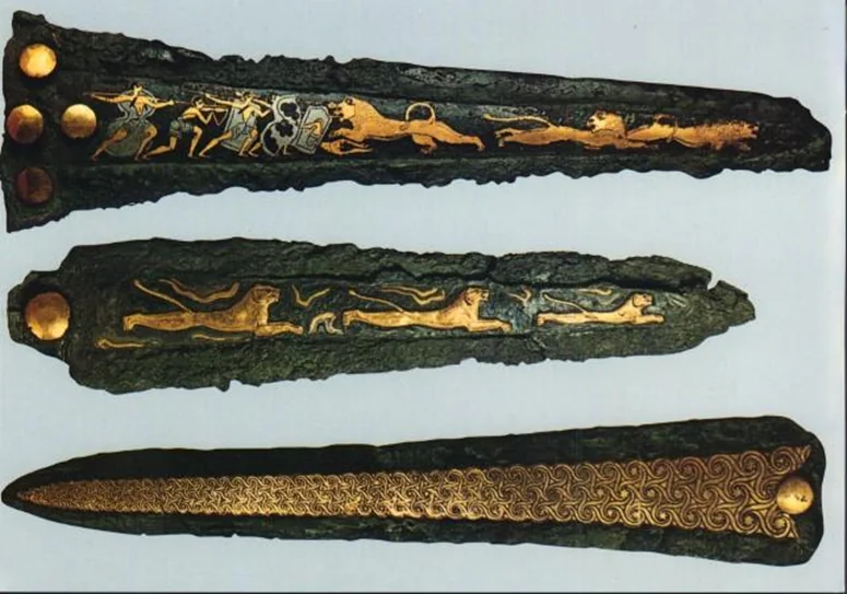 <p><strong><u><span>Date</span></u></strong> - 16th century BC</p><p></p><p><strong><u><span>Location</span></u></strong> : Grave IV, Grave Circle A, Mycenae</p><p></p><p><strong><u>Material</u></strong> : gold, silver and <strong>niello</strong> ( <strong>black compound of metal pushed into engraved parts usually as a border or for fine detail.</strong></p><p></p><p><strong><u><span>Significance</span></u></strong> :</p><ul><li><p><strong>inlay</strong> technique is used</p></li></ul><ul><li><p>evidence of <strong>hunting, weaponry</strong></p></li></ul><ul><li><p><strong>reputation/status</strong> object vs <strong>decorative</strong>.</p></li></ul><p></p>