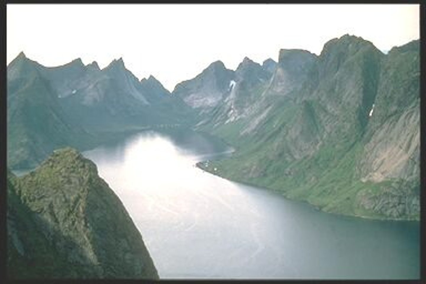 <p>a narrow inlet of the sea between cliffs or steep slopes</p>