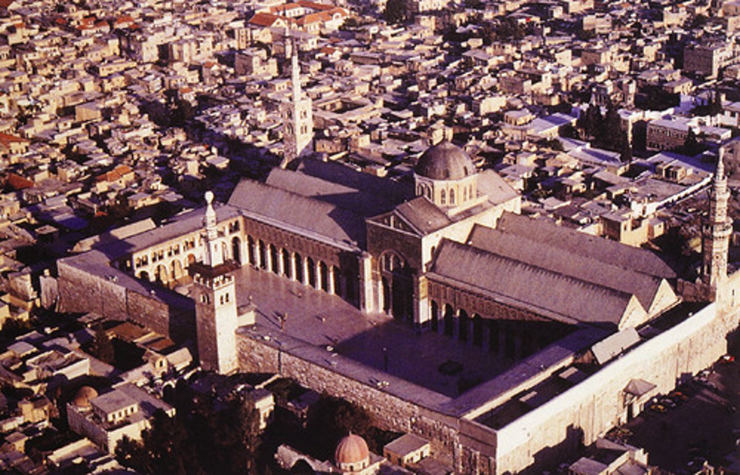 <p>-major city in modern day Syria, in the Middle East/SW Asia</p><p>-by 1200 CE, major Islamic trading city on the Silk Roads and center of trade</p><p>-was the capital city of the Umayyad Caliphate, before they were toppled by the Abbasid Caliphate, who moved their capital to Baghdad where the House of Wisdom was located</p><p>-at times was part of the Abbasid Caliphate and Ottoman Empire</p><p>-famous for having all of the Chinese and Byzantine silks and textiles (cloth, clothing); major trading city for Italian merchants who would ship goods from Syria through the Mediterranean Sea Lanes into Western Europe</p><p>-Chinese and Indian spices would be flowing through Damascus to Europe; gold, salt, and ivory from North Africa; and wool, olive oil, and wine coming from Western Europe</p><p>-Was hit really hard by the Plague, with almost half of the city's population dying from the Black Death in the 1300's; would later be part of the Ottoman Empire</p><p>-Incredibly diverse city with Sunni and Shi'a Muslims, Christians, Jews, Hindus, Buddhists, all represented</p>