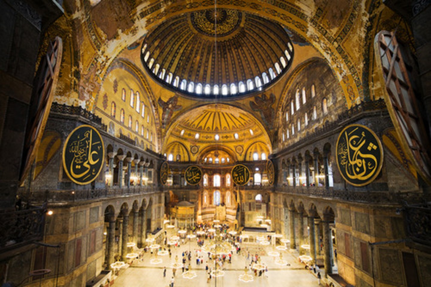 <p>-no supporting columns or similar pieces anywhere near the center<br>-interior of central dome is well-lit by virtue of a ring of windows around its lower circumference<br>-ornate mosaics were originally a substantial aspect of the interior, however, many were altered, covered or destroyed after Turkish invasion<br>-some mosaics survived including the lunette above the south doorway depicts Justinian presenting a model of the church to the Virgin and her child<br>-rendition of the Virgin and her child decorates the conch of the sanctuary apse</p>