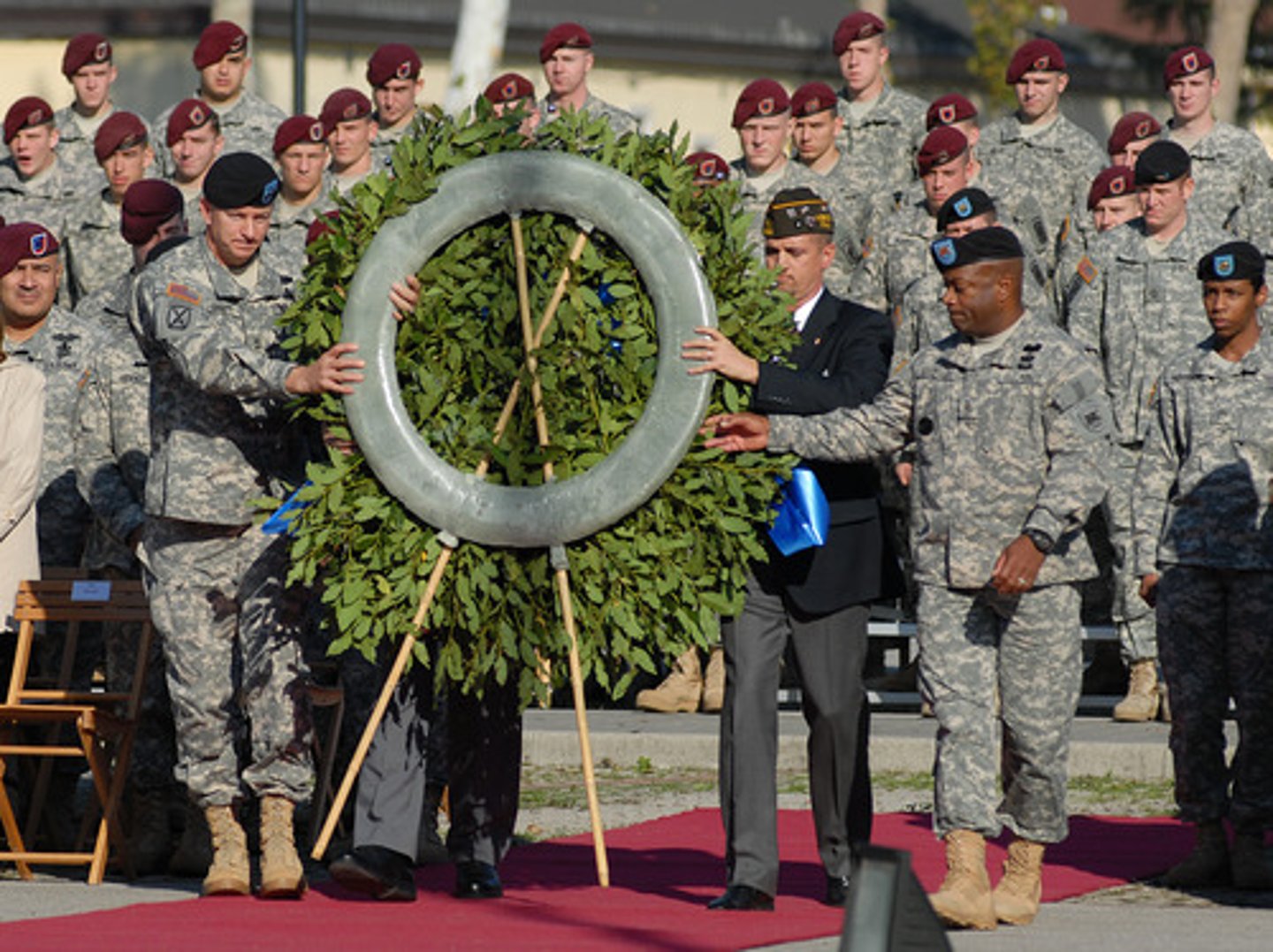 <p>(v.) To recall and show respect for someone; to mark or celebrate an event</p>