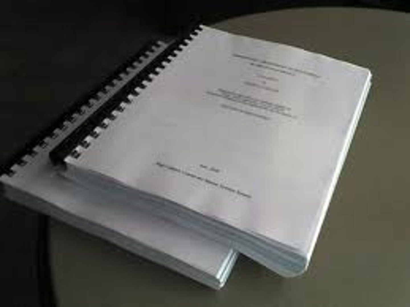 <p>a formal and long paper, written for a degree at a university or college</p>