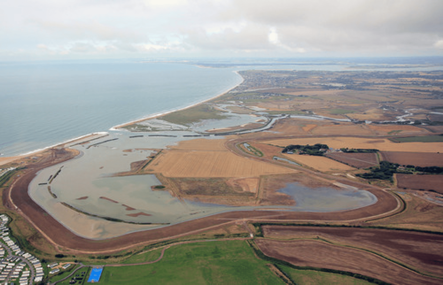 <p>It is located in West Sussex, near Selsey. It is commonly known for its managed retreat scheme.</p>