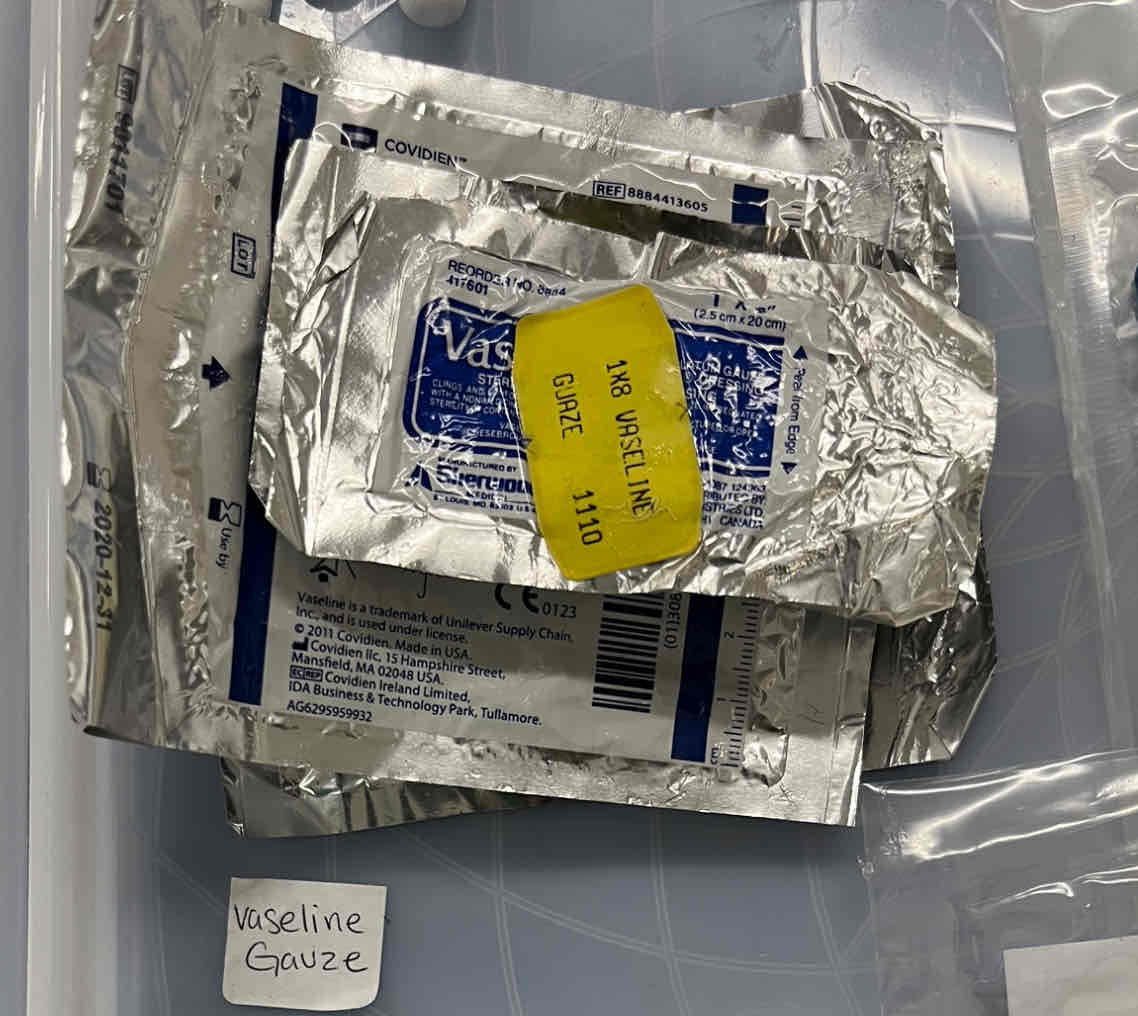 <p>Absorbent gauze impregnated with <strong><mark data-color="red" style="background-color: red; color: inherit">white petrolatum</mark></strong><mark data-color="red" style="background-color: red; color: inherit"> (not adhesive)</mark></p>