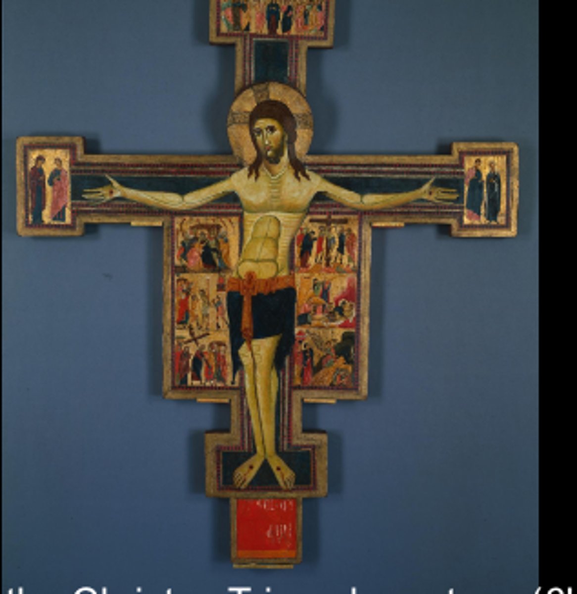 <p>Latin for triumphant Christ; a cross with a representation of a living Christ, eyes open and triumphant over death</p>