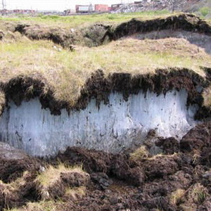 permanently frozen layer of soil beneath the surface of the ground