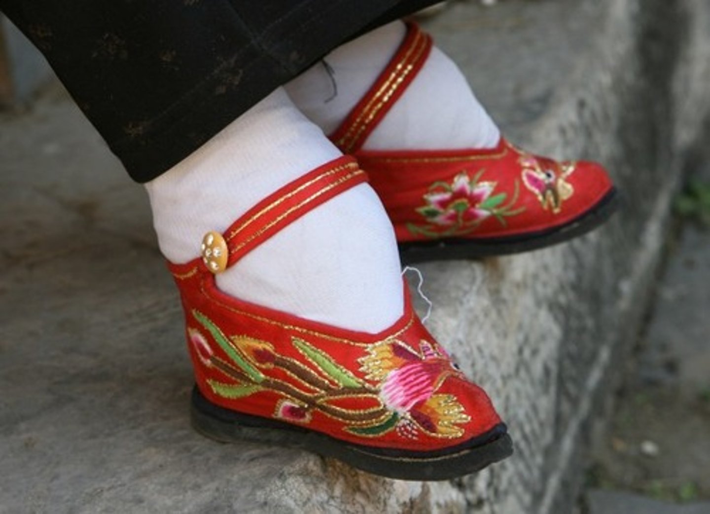 <p>Chinese practice of tightly binding and breaking the feet of young girls in order to change the shape of their feet. Became very popular during the the Song Dynasty, a period in which the status of women declined in China as a result of the importance of Neo-Confucianism.</p>