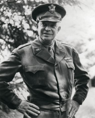 <p>waist-length Army jacket worn in WWII with two breast pockets, fitted waistband, zippered fly closing, and turned-down collar with revers</p>