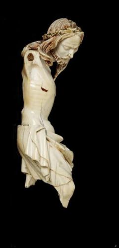 <ol><li><p>artist had the challenge of showing Christ’s outstretched arms using the narrow structure of elephant tusk</p></li><li><p>attached arms separately into pegs and then hid with hair</p></li><li><p>looks down, most likely meant to be held up high</p></li><li><p>Christ’s hair was stained brown but nothing else, ivory’s color was its benefit</p></li></ol>