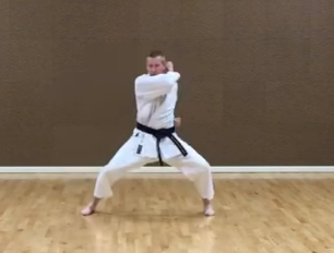 Backwards elbow strike