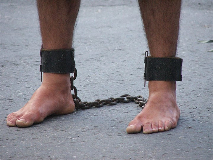 <p>(n.) A chain or shackle placed on the feet (often used in plural).</p><p>(v.) To chain or shackle; to render helpless or impotent.</p><p>Synonyms: (n.) Bond, Restraint; (v.) Bind, Hamper</p><p>Antonyms: (v.) Free, Liberate, Emancipate</p>