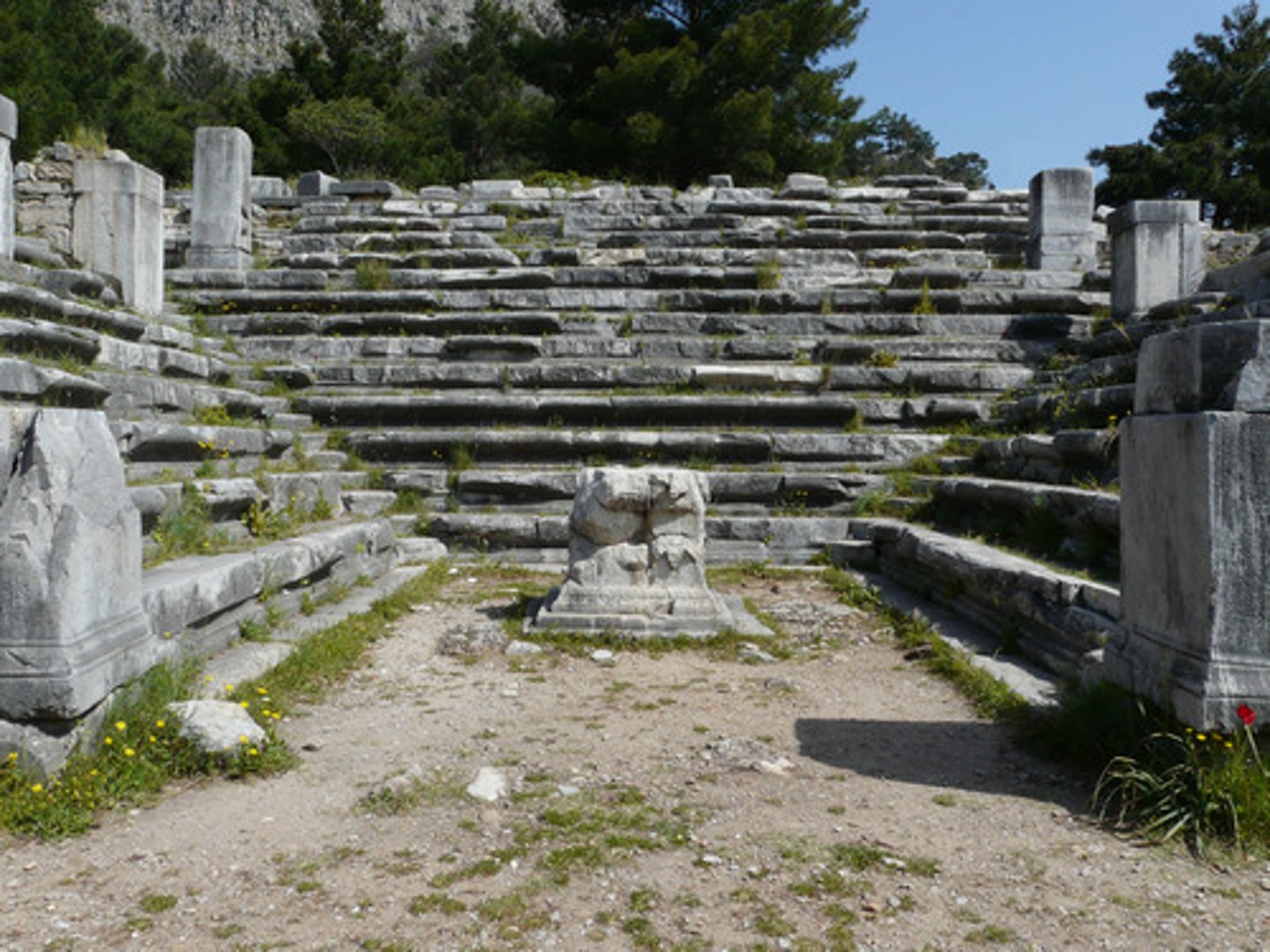 <p>. Priene. <br>Council chamber with rows of stepped benches surrounding a central platform</p>
