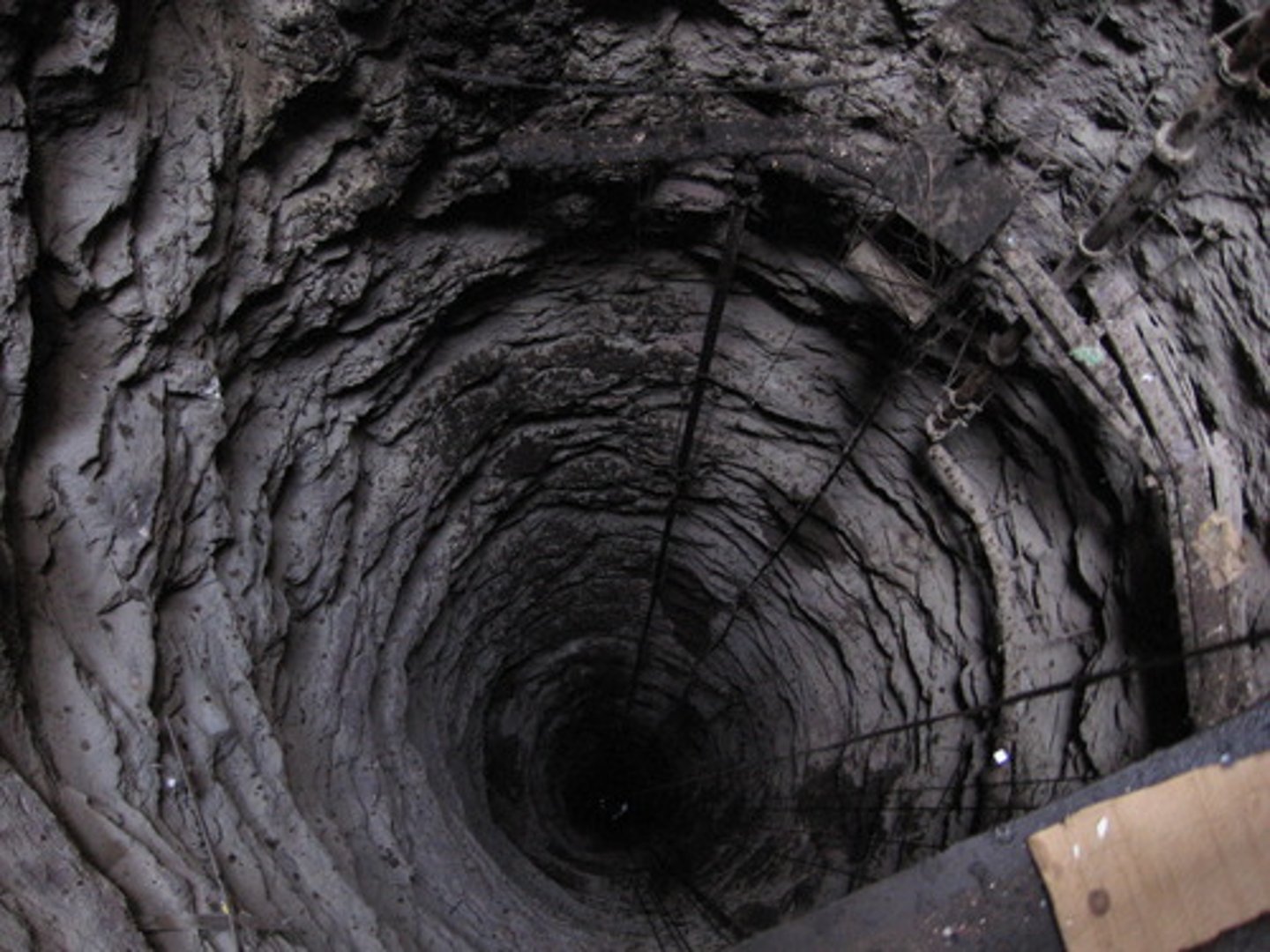<p>a mine shaft which goes down vertically, and miners use lifts/elevators to go down the mine.</p>