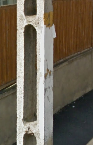 <p>Holes in utility poles but this yellow mark makes it different than any other European country</p>