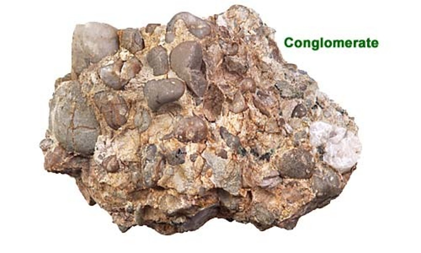 <p>Contains many fragments of light-colored igneous rocks with large crystals in them. These fragments are all well-rounded and contain a dark-colored material between them all.</p>