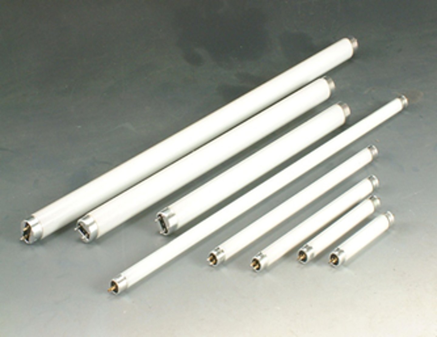 <p>produces light by passing an electric current through a long tube filled with a low-pressure mixture of mercury vapor and argon; requires a ballast</p>