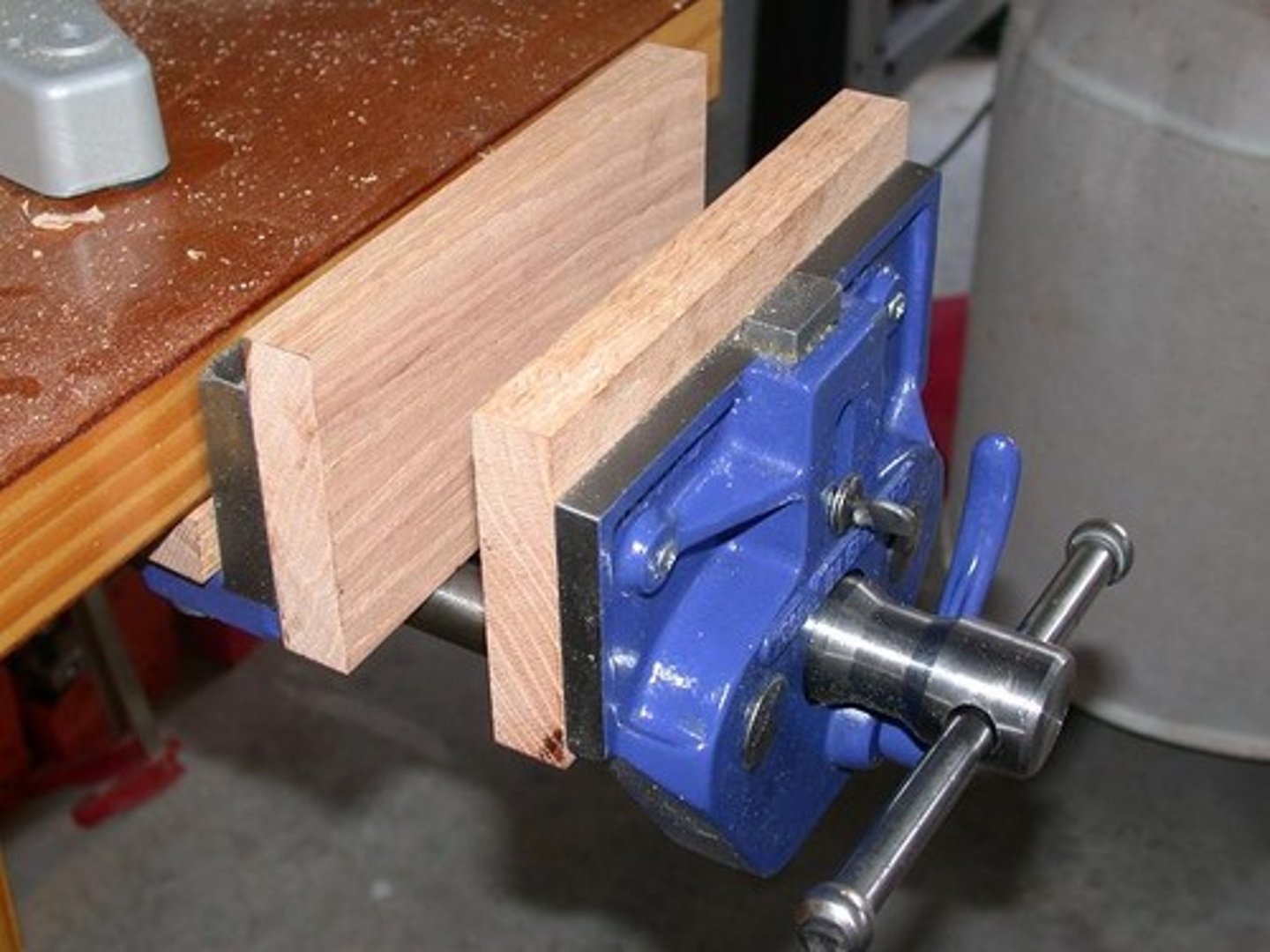 <p>A device that securely holds material in place while working</p>