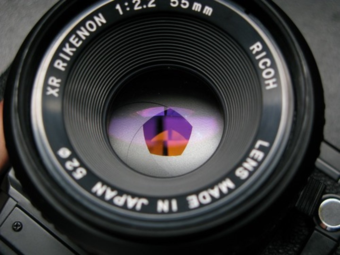 <p>the opening of a camera lens through which light passes. affects the light and sharpness of images.</p><p>if the opening is larger, more light gets in and the image becomes blurrier. if the opening is smaller, less light gets in, and the image is sharper.</p>