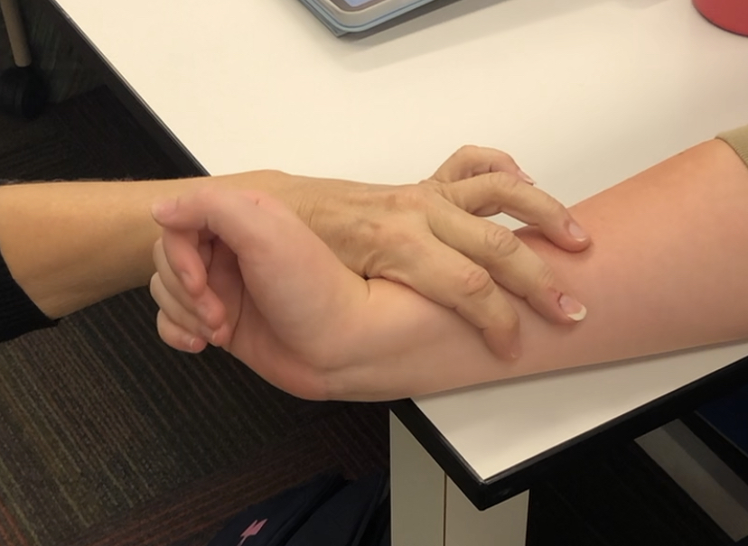 "Keeping your fingers relaxed, can you bring your hand backwards?"