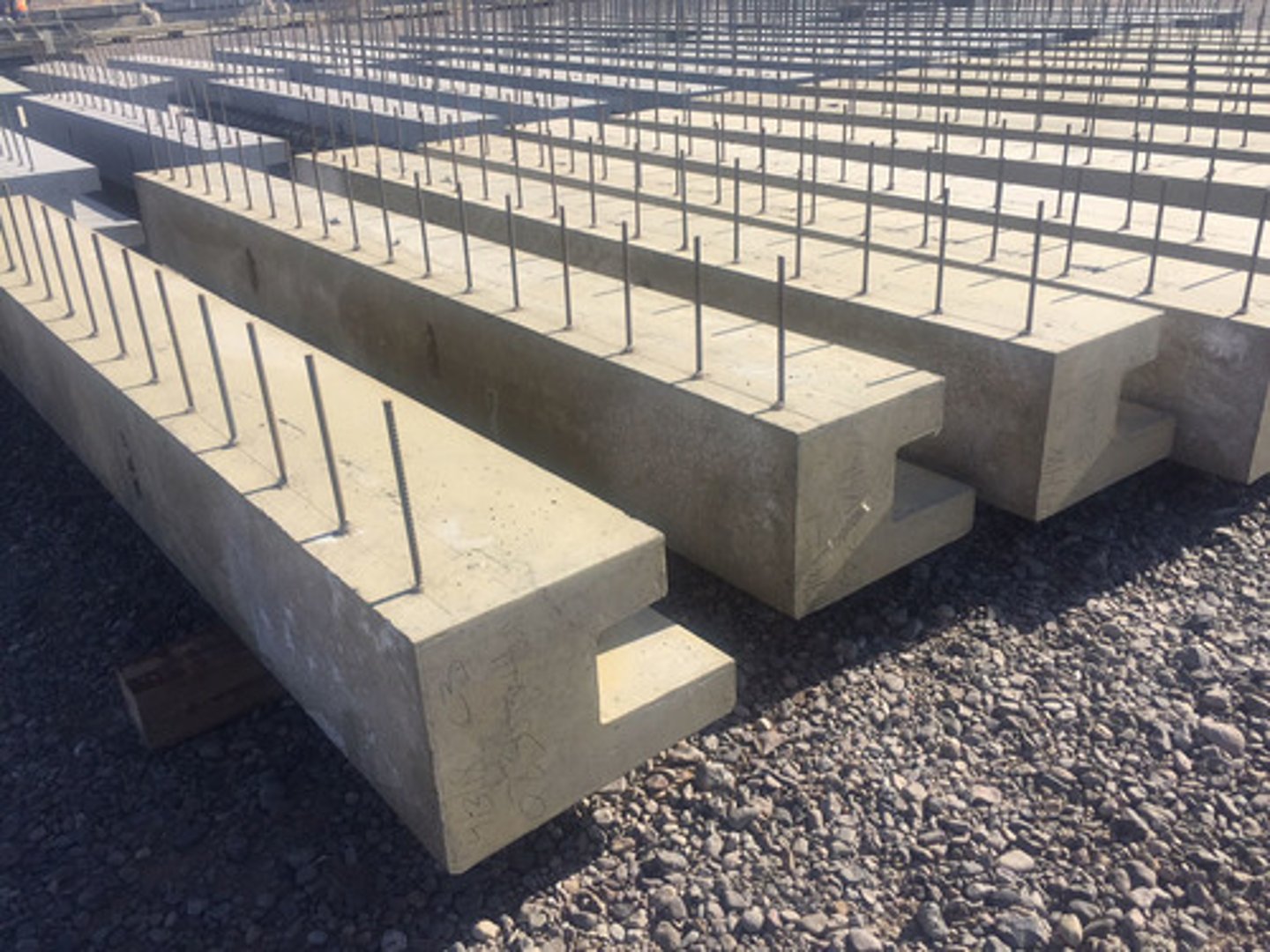 <p>Concrete with low-carbon steel rods (rebar). High compression and tensile strength, consistent, fire-resistant, with few surface defects. Used for buildings, bridge spans, retaining walls, and grid floors.</p>