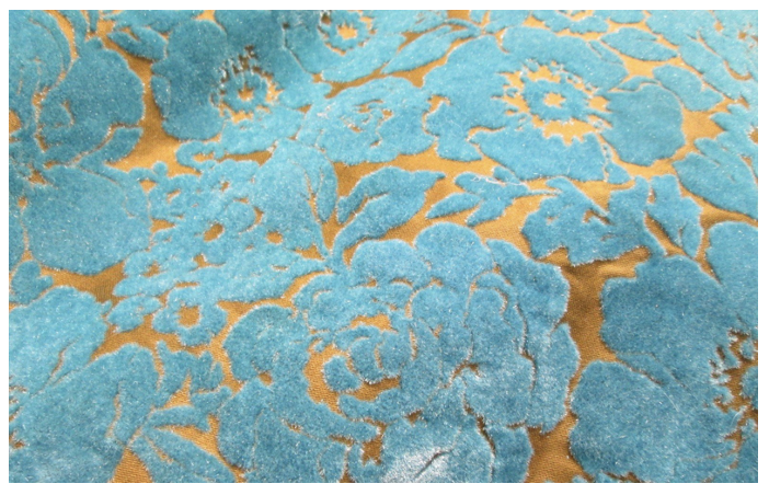 <p>A process where a fine natural or synthetic surface fiber is applied onto a base fabric.</p>
