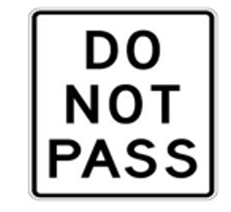 <p>What does a Do Not Pass sign prohibit?</p>