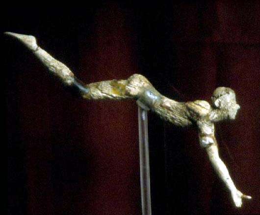 <p>The ivory figurine of an acrobat from Knossos may have been a part of a group of “bull leaper” statuettes.</p>