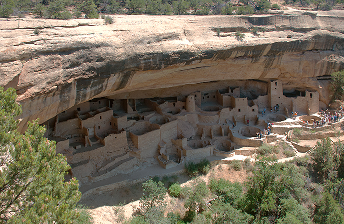 <p><strong>Form: </strong>600 structures built into cliffs (underneath/outside) of a flat top mountain in the 4 corners region of the US. Wooden beamed roofs. </p><p>-There are 150 rooms which are well protected from natural elements because of the location. 1-4 story buildings made of stone, mud mortar, and wooden beams used. (Shift from original buildings made of adobe)</p><p>-Kivas: circular rooms with wooden-beamed roofs, a fire pit, ventilation shaft, and small ceremonial hole in the floor. Families are in architectural units surrounding this. Used for ceremonies AND residential.</p><p></p><p><strong>Function: </strong>residential/storage/ritualistic housing for 125 people. Courtyards (concaved in areas) are for communal gatherings. Dwellings were accessed with retractable ladders.</p><p></p><p><strong>Content: </strong>murals and geometric shapes in orange, red, and brown located in the buildings </p><p></p><p><strong>Context: </strong>built by the Puebloans. The habitat it’s located in is now a national park. Structures were carved into the cliffs in a cool climate which provided shade/protection from the snow. </p><p>-Puebloans were sedentary farmers who cultivated beans, squash, and corn</p><p>-End: droughts could have caused food shortage and conflict, causing abandonment </p>