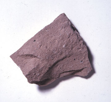 <p>Light/pink, fine-grained, very light density, igneous</p>