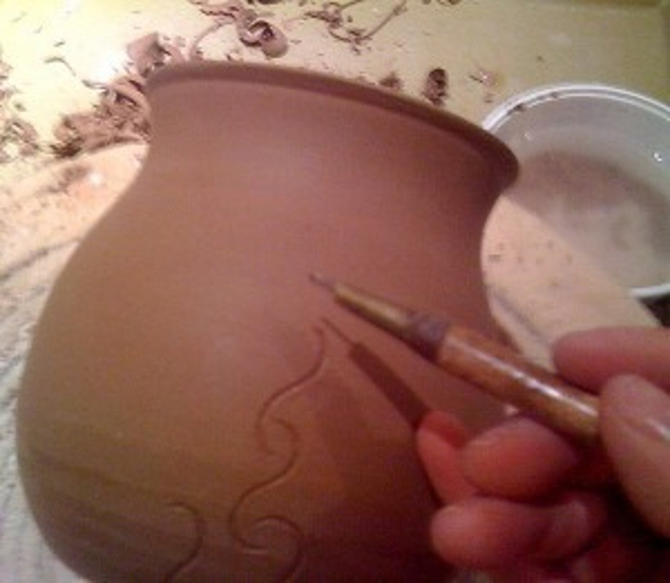 <p>clay that has partially dried but is not completely dry</p><p>the artist can carve the piece or add decorative slip in this stage.</p>