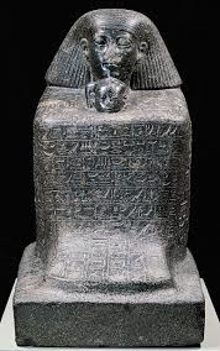 <p>In ancient Egyptian sculpture, a cubic stone image with simplified body parts.</p>