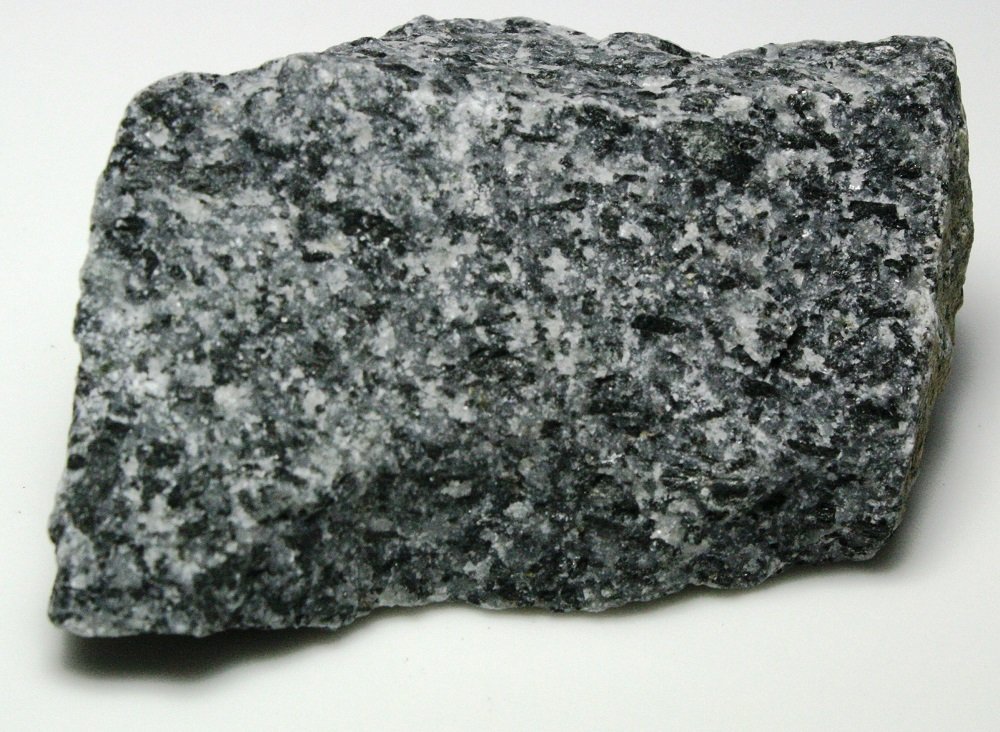 <p>Igneous rock: Diorite</p><p><strong>Diorite is an intrusive igneous rock composed primarily of plagioclase feldspar and smaller amounts of mafic minerals like hornblende and biotite. It has a phaneritic texture, meaning its interlocking crystals can be seen with the naked eye. It is known for having a characteristic ‘salt and pepper’ appearance.</strong></p><p><br><strong>Diorite has a coarse-grained texture with large, interlocking crystals of white to off-white plagioclase feldspar and darker, mafic minerals like hornblende, biotite, and pyroxene. Its crystals are roughly equal-sized and it is intermediate in color with a characteristic ‘salt and pepper’ appearance.</strong><br></p>