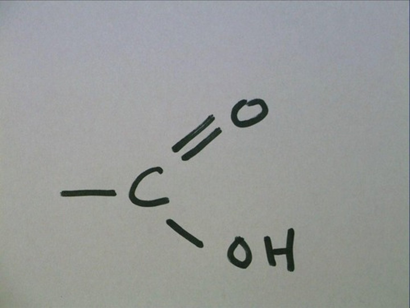 <p>-COOH</p><p>A functional group present in organic acids and consisting of a single carbon atom double-bonded to an oxygen atom and also bonded to a hydroxyl group.</p>