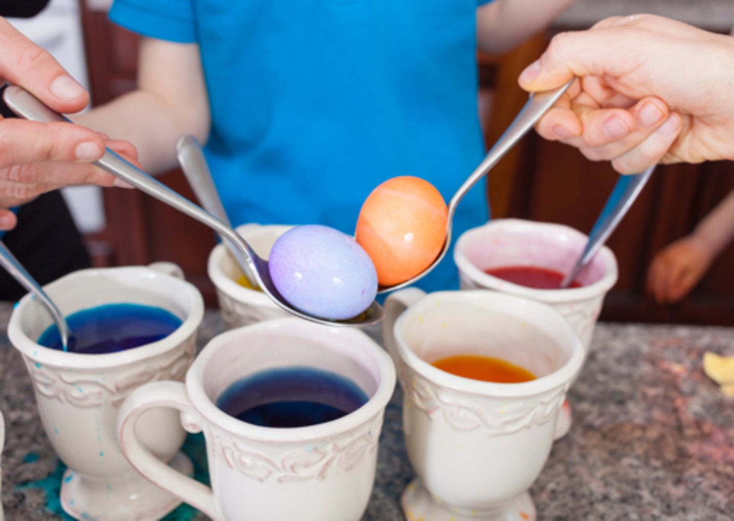 <p>change the colour of eggs using dye, often done for Easter</p>