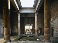 The formal entrance hall of an ancient Roman house, open to the sky at the center and usually featuring a pool for the collection of rain water