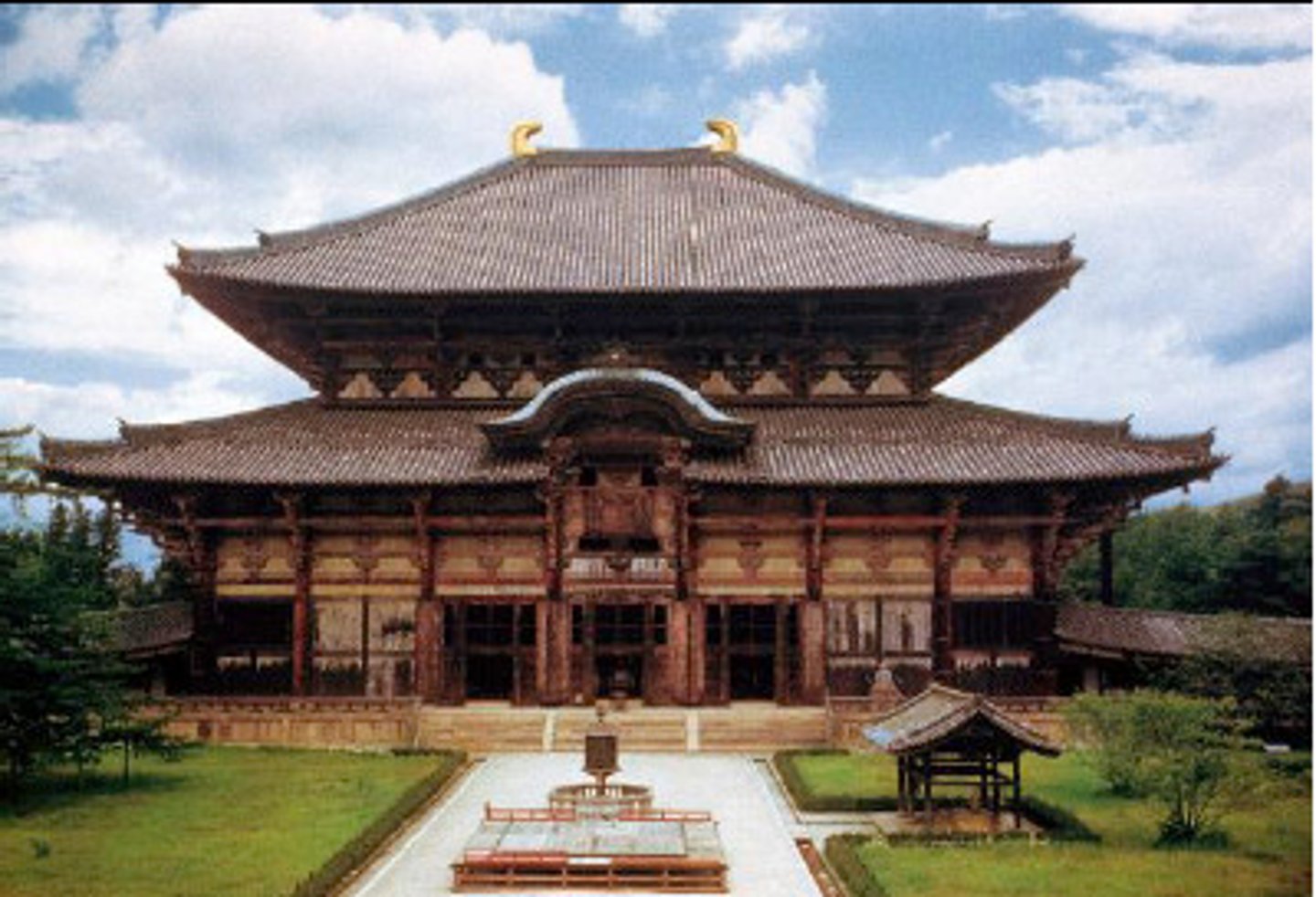 <p>Nara, Japan</p><p>Various artists, including sculptors Unkei and Keikei, as well as the Kei School</p><p>743 CE (rebuilt in c. 1770)</p><p>Form: Bronze and Wood (sculpture), and Wood with Ceramic-tile roofing (architecture)</p><p>Function: The Great Buddha Hall. Served as a worship place</p><p>Inside the hall sits a colossal statue of the Vairocana Buddha. The statue is almost 165 feet tall and is made from a copper casting. The right hand is in the mudra sign, meaning "do not fear", while the left hand is outstretched with the palm up, as if to say, "welcome". Buddha's priest, Shunjobo Chogen, was selected to lead the project. After the temple was burned, the Japanese aristocracy and warrior elite donated money to have the facility rebuilt.</p>