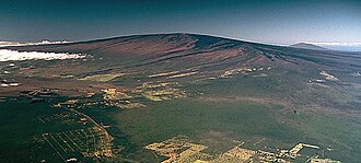 <p>-A broad and flat volcano! happens in the middle of a tectonic plate over a hot spot (patch of extra intense heat) that causes the earth to bulge and grow with magma and open up over time.</p><p>-as the plate slides along the surface, the hot spot moves over a new spot of ground causing a new volcano/ forms a line of volcanos that marks the movement of the plate</p>