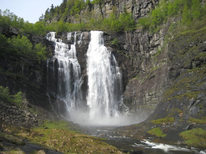 <p>...waterfalls flow over an area of hard rock and then soft rock<br>-form a step (the soft rock is eroded by hydraulic action and abrasion more than by the hard rock)<br>-hard rock is undercut by erosion. It becomes unsupported and collapses.<br>- The collapsed rocks are swirled around at the foot of the waterfall where they erode the softer rock by abrasion, this creates a deep plunge pool.<br>- Over time more undercutting will cause more collapses, the waterfall will retreat leaving a steep-sided gorge.</p>