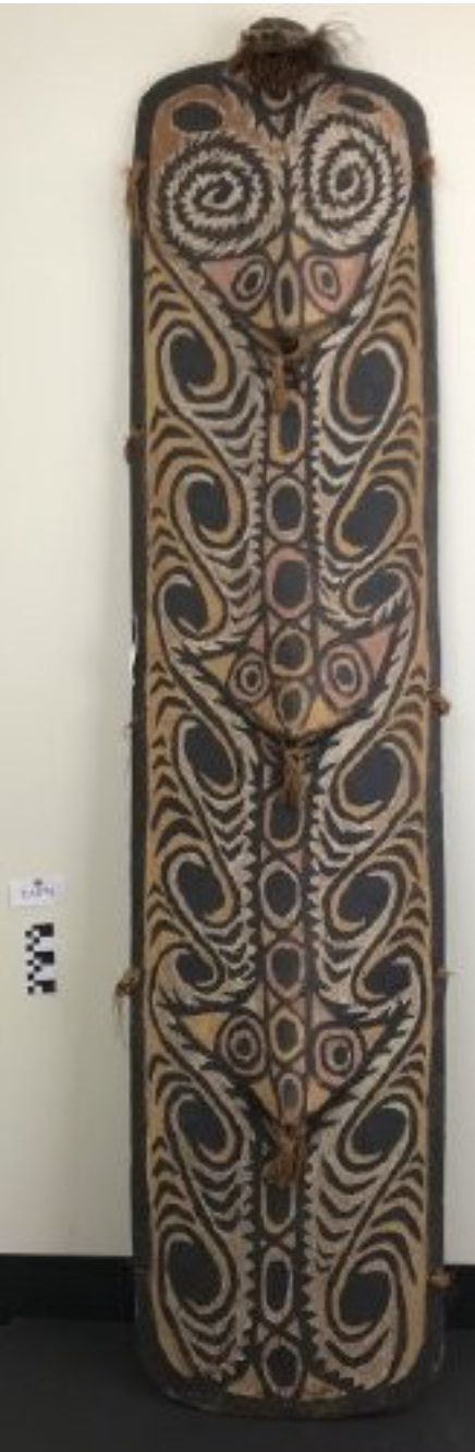 <p>Projecting faces through relief carving, represent spirits and spears</p><p>Both men and women in this culture engage in combat</p>