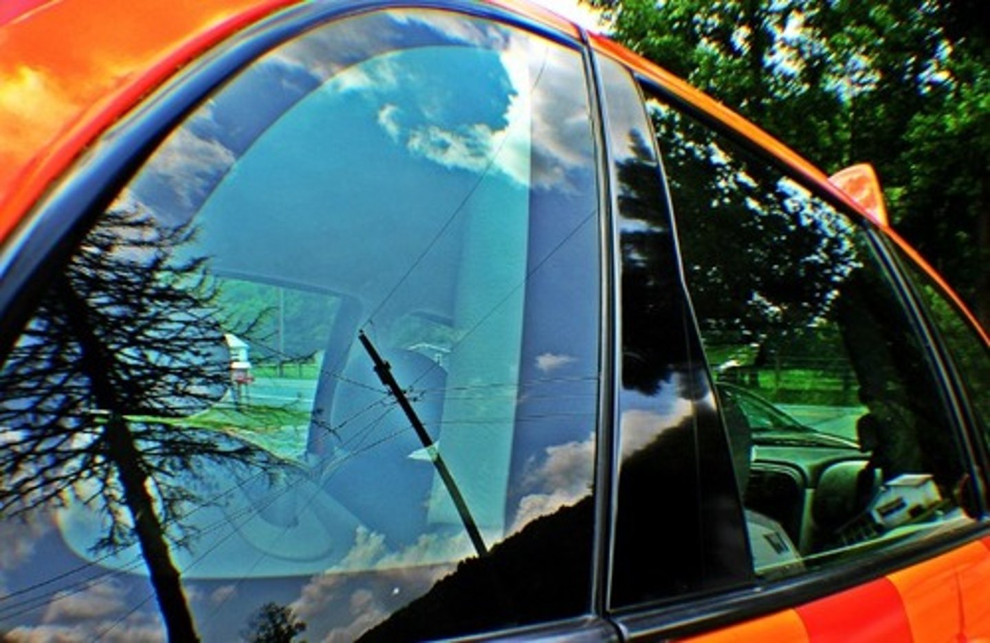 <p>Occurs when light reflects off a smooth or semi-glossy surface and creates a bright glare that "veils" or washes out the object or information on that surface</p>