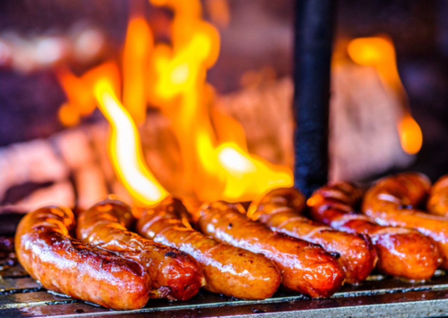 <p>to cook over the fire or heat, usually on a barbecue.</p><p>Tom stood by the barbecue to _________ carefully, while I prepared the buns and salad in the kitchen.</p>