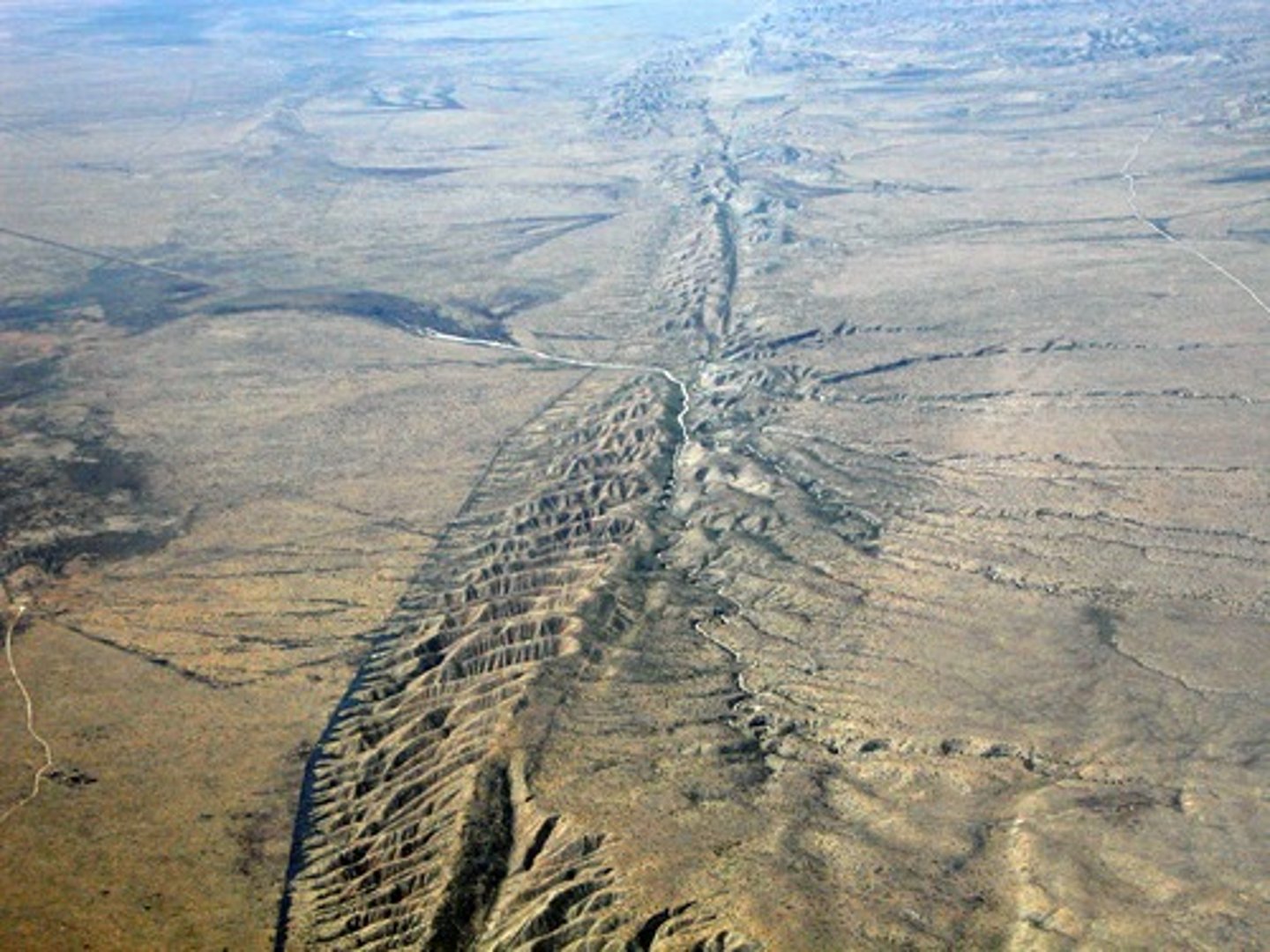 <p>a large expanse of rock where a fault has occurred</p>