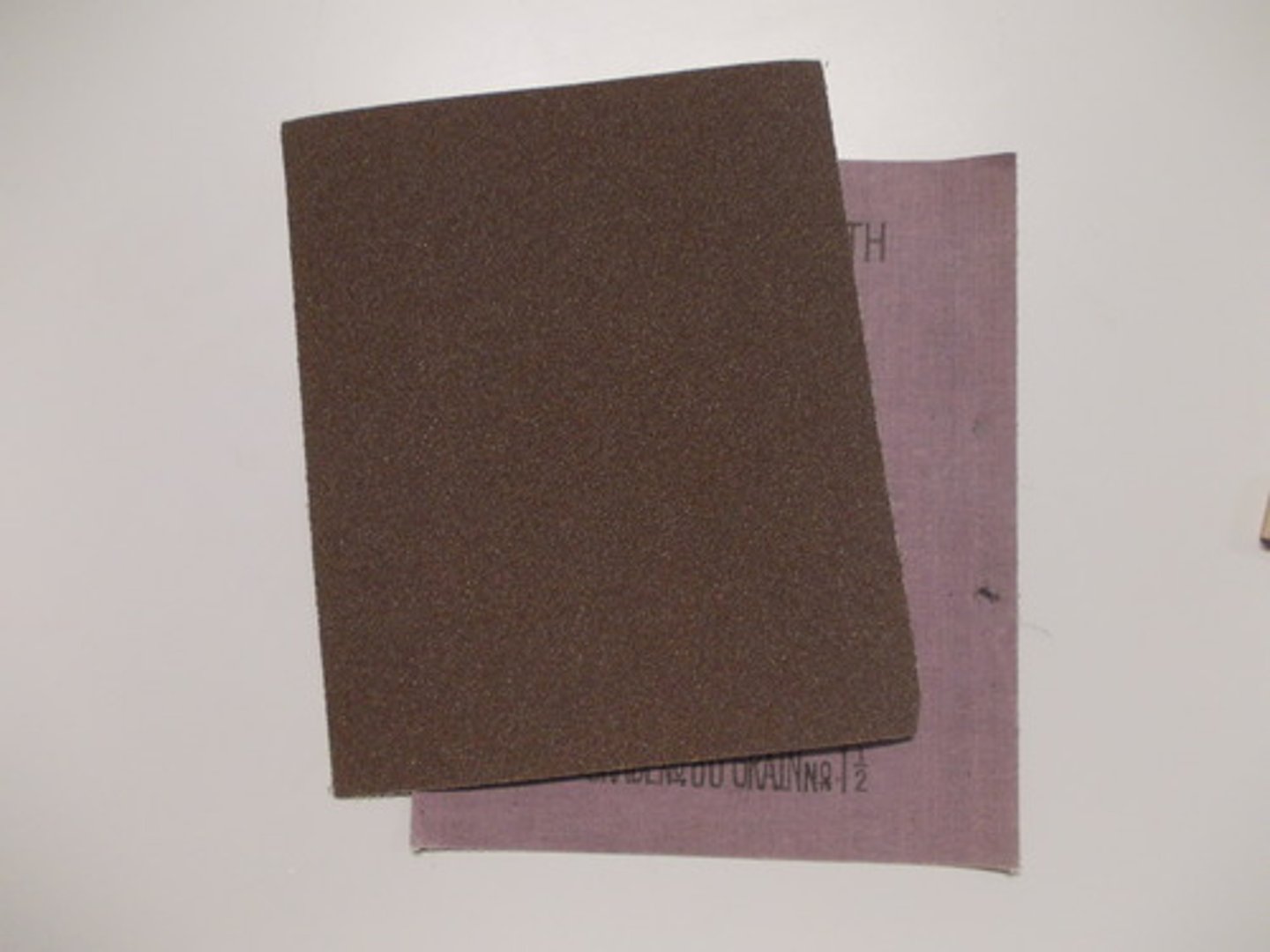 <p>An abrasive paper with a waterproof backing to allow use with water. Commonly used for paint finishing on metals or to finish acrylic edges to produce a very smooth surface.</p>