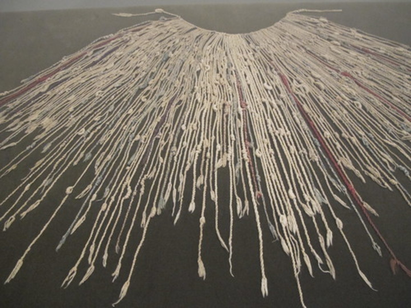 <p>-This was a system used by Incan bureaucrats (government officials) that helped them keep track of responsibilities and records</p><p>-it was a string of cords of different lengths and colors. Officials would tie knots on certain cords in order to help them keep track of population sizes, taxes, and labor services that were owed to the government</p>