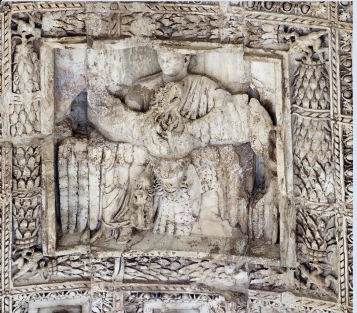 relief in the passageway of the vault of the arch of Titus, Livia is Hand gliding on the eagle  being taken heavenward to the Gods. 
