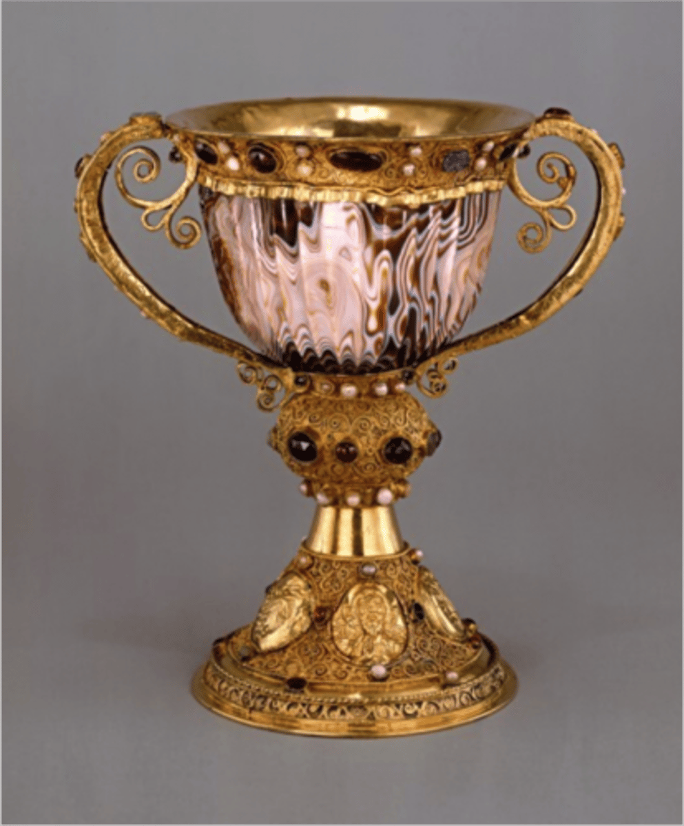 <p>A large cup used in Christian liturgical ceremonies to hold wine, representing the blood of Christ during the Eucharist.</p>