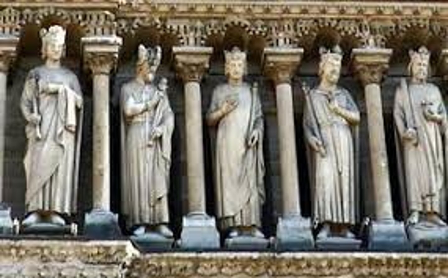 <p>The band of statues running the full width of the facade of a Gothic cathedral directly above the rose window. These were the kings of Judah and Israel.</p>